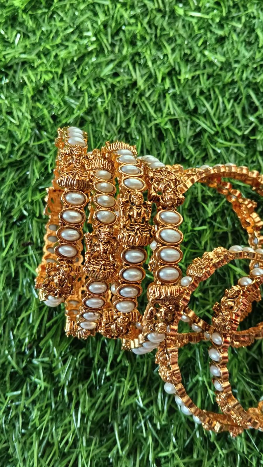 Lakshmi Pearl Bangles: Add a graceful traditional touch to your jewellery collection with the Lakshmi Pearl Bangle ✨  .