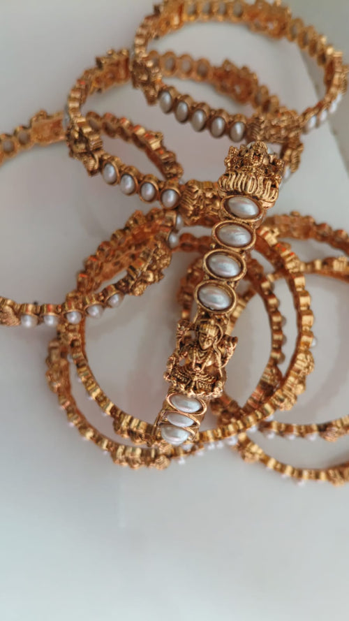 Lakshmi Pearl Bangles: Add a graceful traditional touch to your jewellery collection with the Lakshmi Pearl Bangle ✨  .